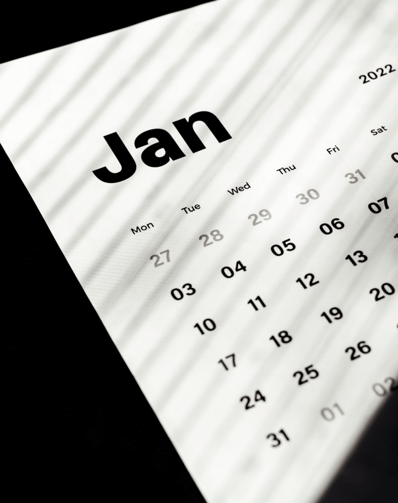A calendar for the month of January 2022 with light streaks on it.